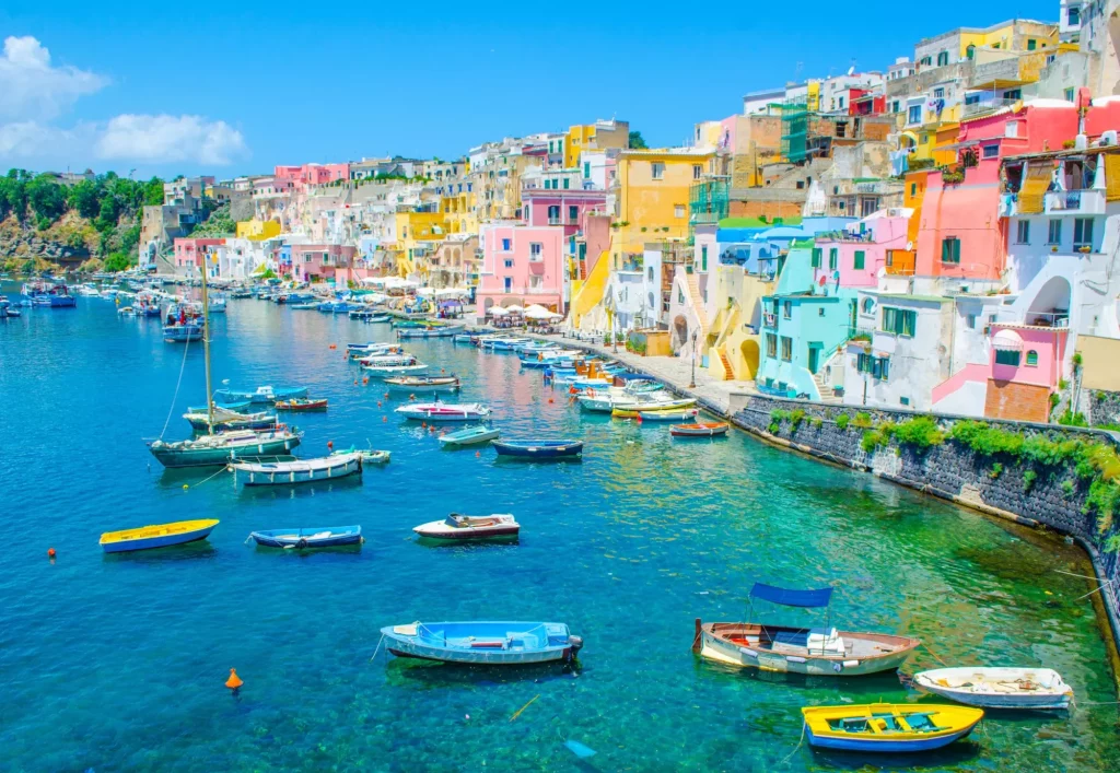 italian island procida is famous for its colorful marina, tiny narrow streets and many beaches which all together attract every year crowds of tourists coming from naples - napoli.
